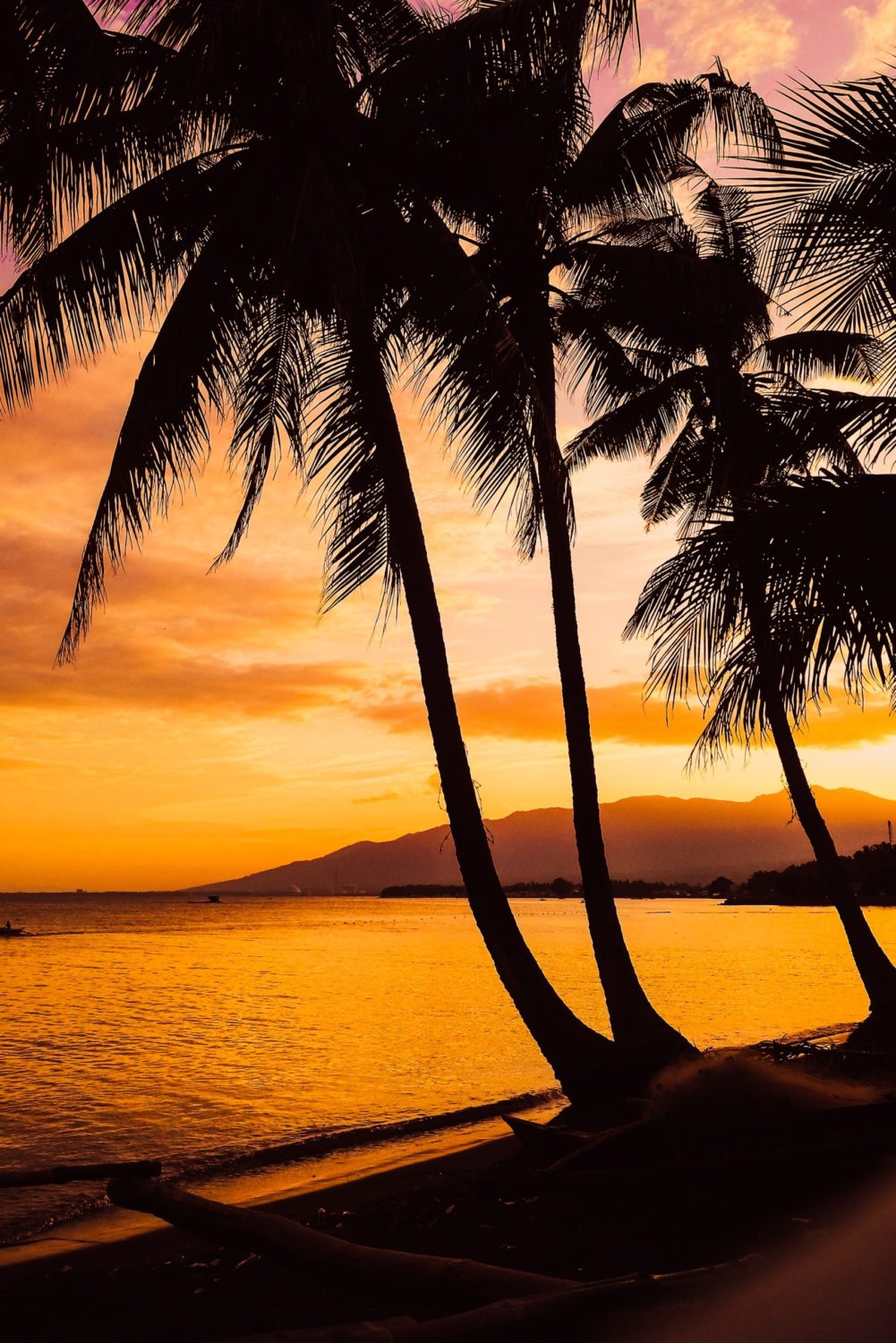 a sunset over a body of water