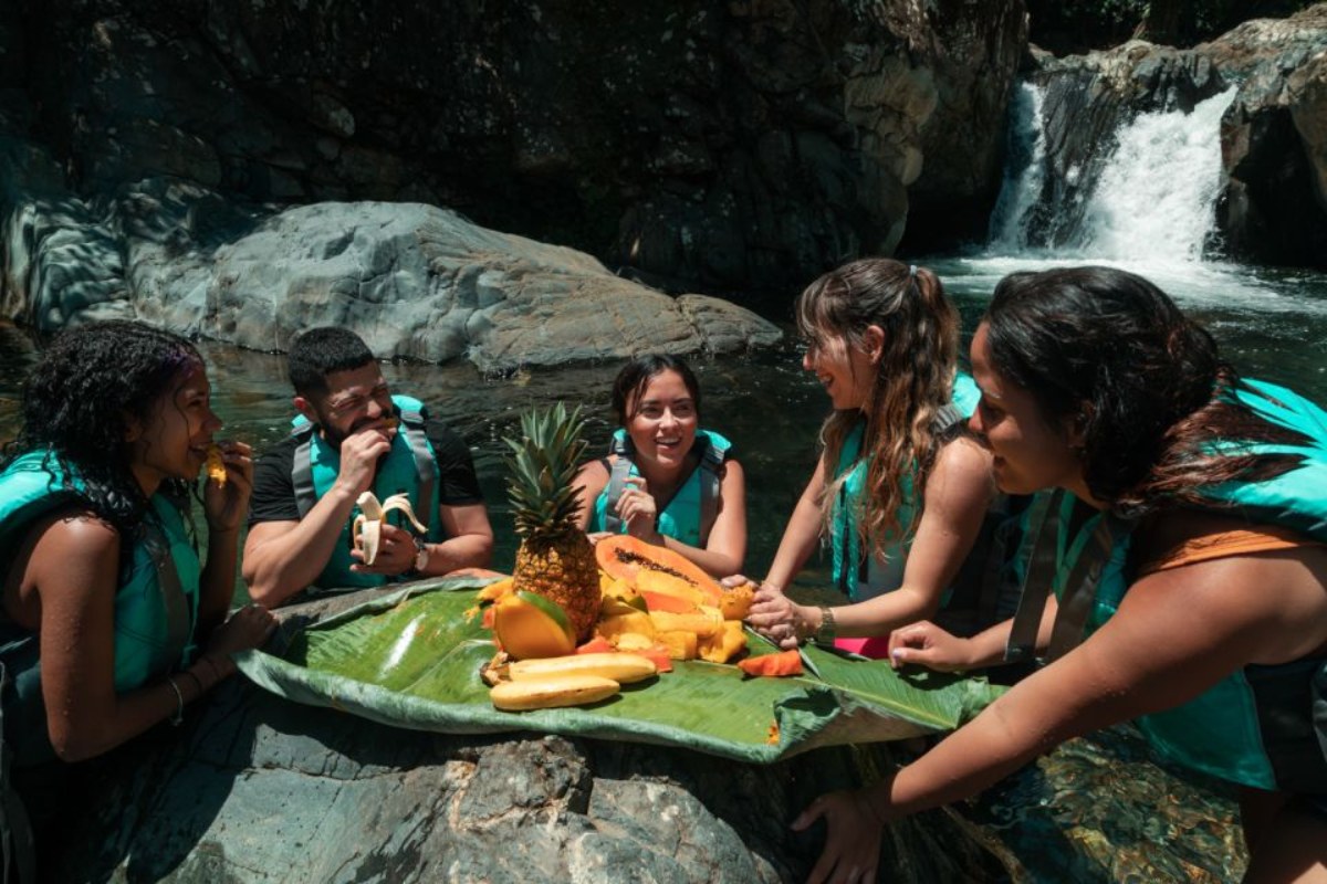 Tour group enjoying fresh Puerto Rican fruit in El Yunque