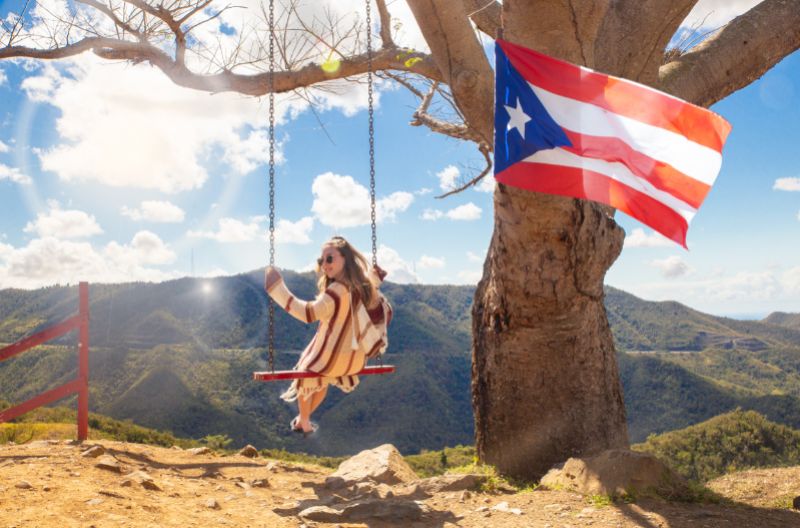 Girl Swinging in above the montain